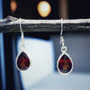 Garnet faceted tear drop shape silver earrings